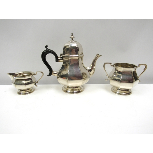 8230 - A Henry Matthews silver Bachelors three piece teaset with ebony handle, Birmingham date marks rubbed... 