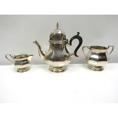 8230 - A Henry Matthews silver Bachelors three piece teaset with ebony handle, Birmingham date marks rubbed... 