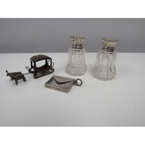 8234 - A silver envelope stamp case, pepper pots and sledge (3)