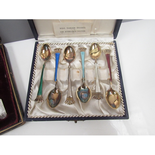 8260 - A cased set of Danish enamel and sterling silver spoons together with a cased set of silver teaspoon... 