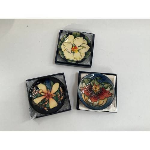 8064 - Three Moorcroft pindishes, Panache, Southern Magnolia and Anna Lily, all boxed