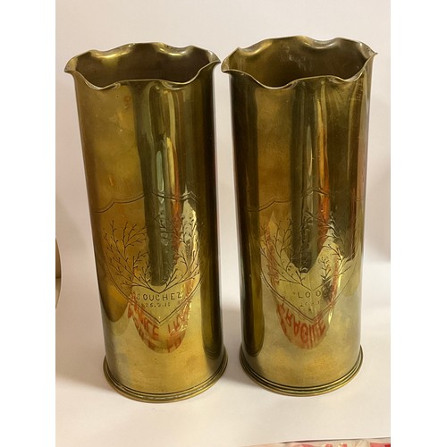 5439 - A pair of WWI trench art brass shell cases with wavy rims and engraved detail