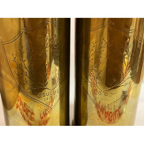 5439 - A pair of WWI trench art brass shell cases with wavy rims and engraved detail