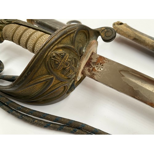 5436 - An 1827 pattern Naval Officer's sword, the blade by Gieves, George Crown, ray skin grips, scabbard f... 