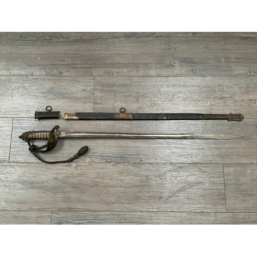 5436 - An 1827 pattern Naval Officer's sword, the blade by Gieves, George Crown, ray skin grips, scabbard f... 