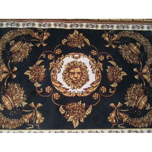 1474 - A large wool rug, black ground with gold and brown floral decoration and a Greek key border, 236cm x... 