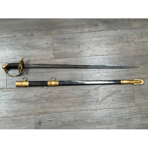 5430 - A replica Confederate sword, brass guard with CS pierced brass hilt, engraved blade with single full... 