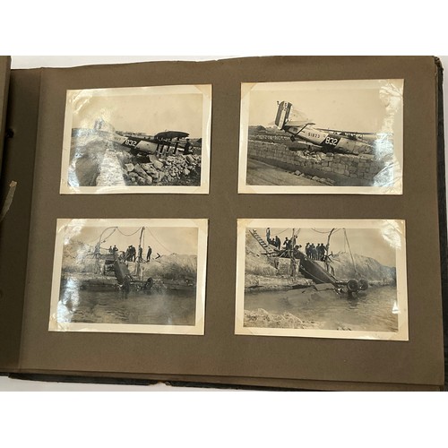 5352 - A WWII photograph album including British service aircraft, bombing, naval battleships and aircraft ... 