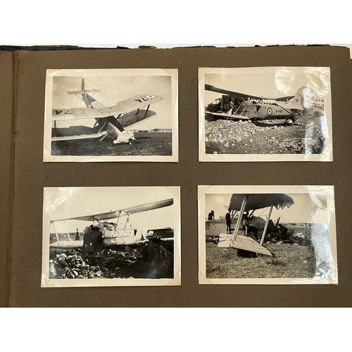 5352 - A WWII photograph album including British service aircraft, bombing, naval battleships and aircraft ... 