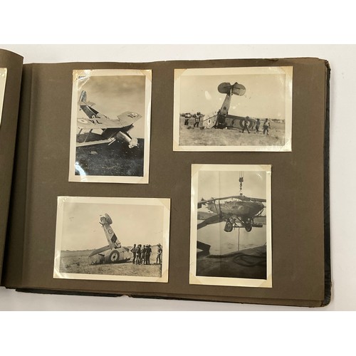 5352 - A WWII photograph album including British service aircraft, bombing, naval battleships and aircraft ... 