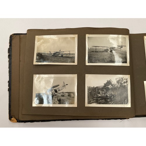 5352 - A WWII photograph album including British service aircraft, bombing, naval battleships and aircraft ... 