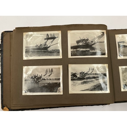 5352 - A WWII photograph album including British service aircraft, bombing, naval battleships and aircraft ... 