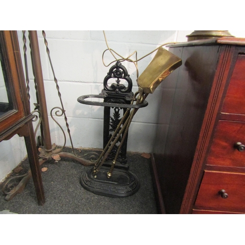 1006 - A Victorian cast iron stick stand, a three piece set of brass fire irons and a pair of 19th Century ... 