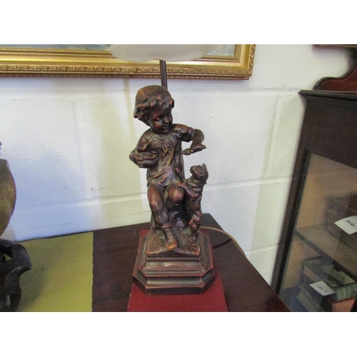 1014 - A pair of figural lamps of children with dogs