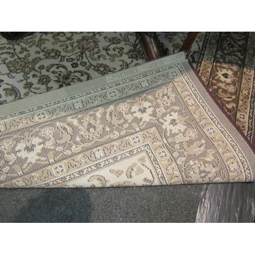 1022 - A Belgian brown and beige ground rug, 196cm x 132cm