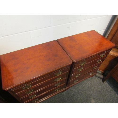 1077 - A pair of Georgian style walnut and mahogany bachelor's chests of four graduating drawers with brush... 