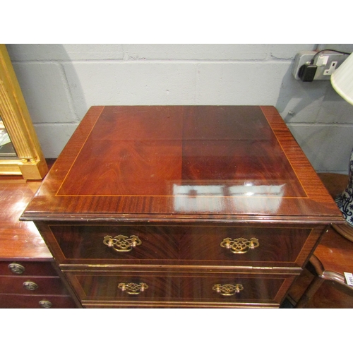 1088 - A mid 20th Century reproduction mahogany pseudo straight front chest of four long drawers, disguisin... 