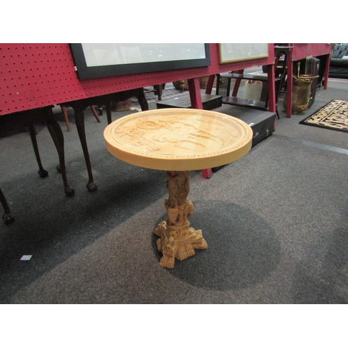 1121 - A carved resin chinoiserie style table with glass top. 50cm high x 45cm diameter