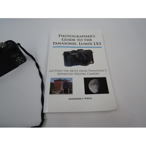 1293 - A Panasonic Lumix DMC-LXS digital camera with manual and accessories