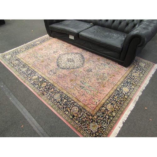 1169 - A large floor rug, pink ground, floral design, tasseled edges 280cm x 200cm