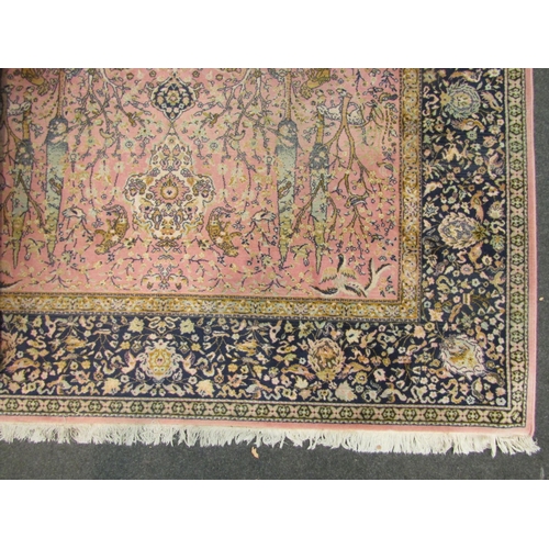 1169 - A large floor rug, pink ground, floral design, tasseled edges 280cm x 200cm