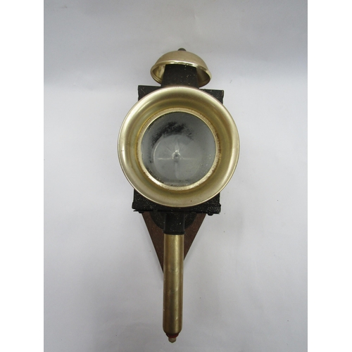 4080 - A metal coaching lamp mounted on diamnd shaped wooden back