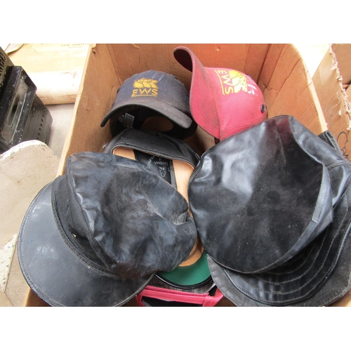 4196 - A box containing various railway hats including grease top and caps