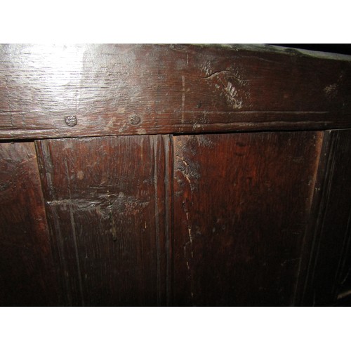 3 - A 17th Century pegged oak coffer the split hinge top over a four panel base on stile feet, 108cm wid... 