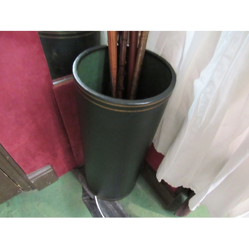 150 - A green leather cylindrical stick stand with gilt leaf decoration and internal drip tray, 60cm high