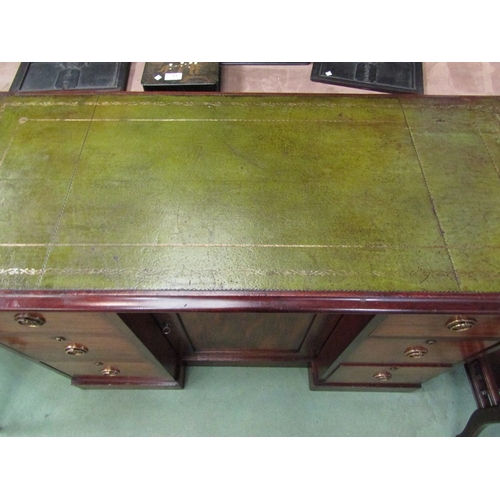 180 - Circa 1860 a mahogany breakfront desk, the gilt tooled leather insert writing surface over six drawe... 