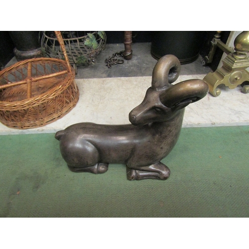 182 - A painted terracotta hollow figure of a goat with bronzed finish, Deco in style, restoration to horn... 