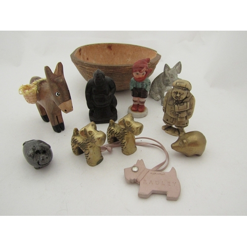 322 - A shell bowl containing miscellaneous Buddhas, brass dogs, Radley dog leather fob etc