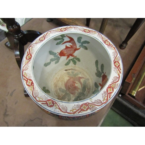 10 - A Chinese jardiniere of large proportions with koi decoration to interior, 37cm diameter, 31cm tall