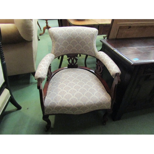 162 - A late Victorian tub chair with silk fan decorated upholstery, cabriole fore legs to castors