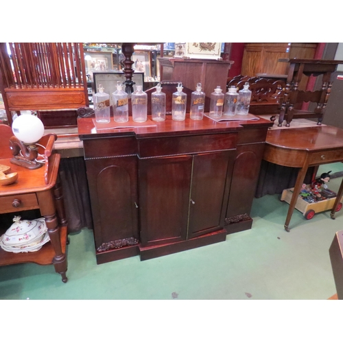 193 - Circa 1820 a Regency flame mahogany breakfront sideboard with central frieze drawer over a four door... 