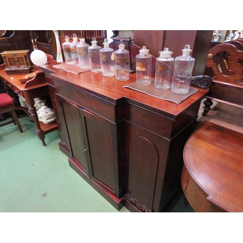 193 - Circa 1820 a Regency flame mahogany breakfront sideboard with central frieze drawer over a four door... 