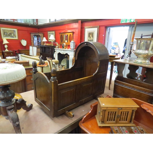 200 - A 17th Century style oak panelled crib, 70cm high