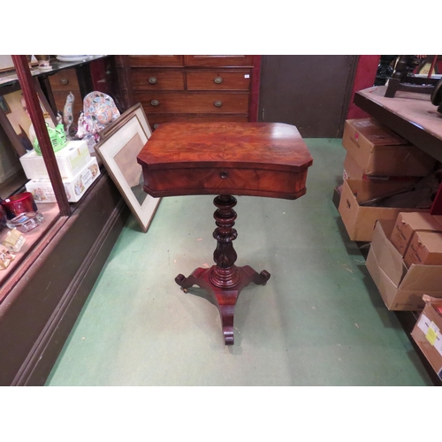 213 - A circa 1840 flame mahogany concave front work table with well fitted interior over a turned and aca... 