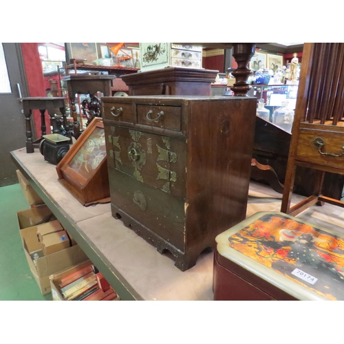 214 - A miniature Chinese cabinet with two drawers and two cupboard doors, decorative metalwork, 45cm x 42... 