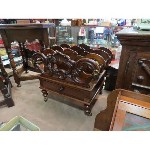 218 - A 19th Century rosewood three division Canterbury with carved decoration over a single base drawer o... 