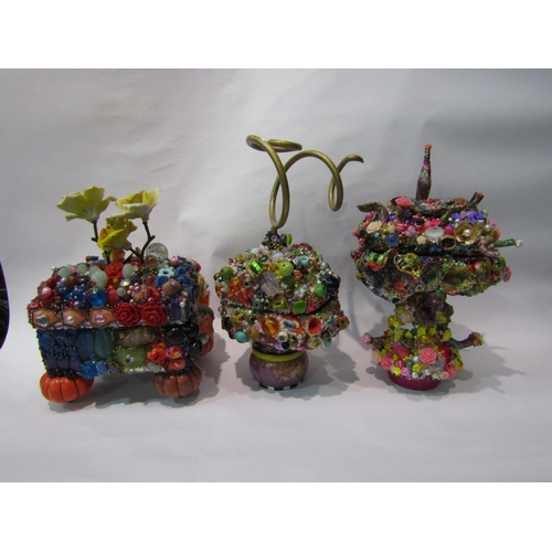 245 - Carolyn Sims: Three lidded boxes with colourful allover applied decoration of beads, trinkets and no... 