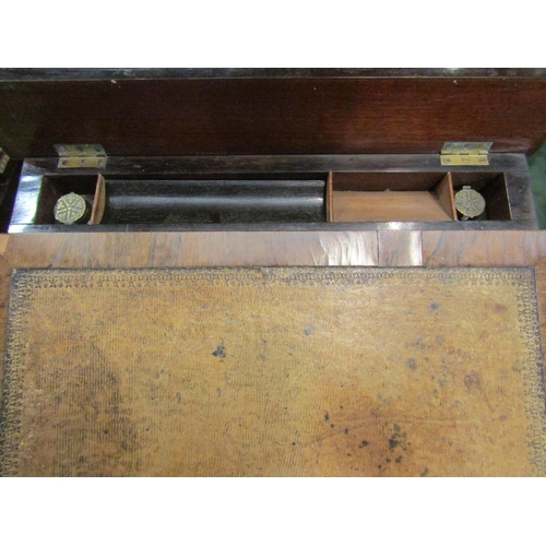 8 - A 19th Century veneered writing desk with faux drawers and single drawer to side with lid opening to... 