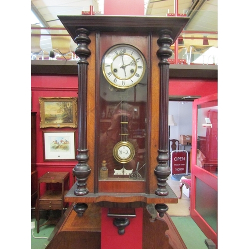 64 - A mahogany cased drop dial wall clock with glazed front, enamel Roman numerated dial, key and pendul... 