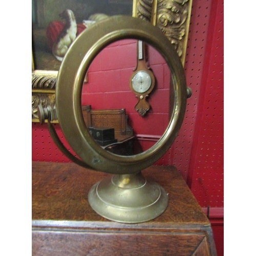 118 - A brass circular free standing mirror   (R) £0