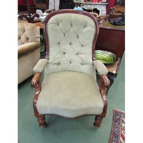 174 - A mid Victorian walnut spoon/button back rest armchair on scroll arms over a serpentine front seat o... 