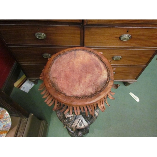 185 - An African wooden drum with carved detail, animal skin head, 89cm tall