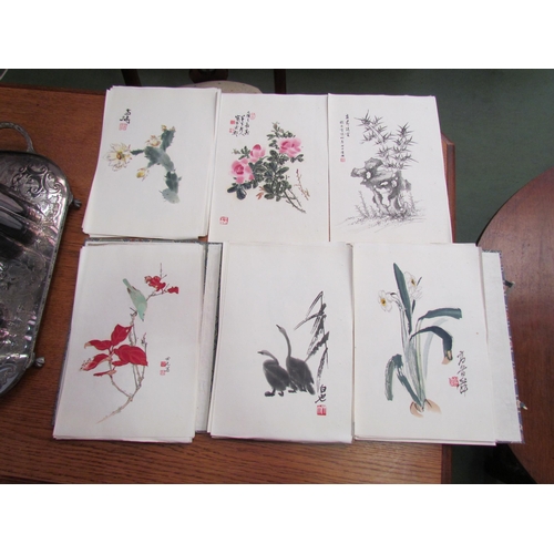 24 - An early to mid  20th Century portfolio of Japanese colour prints, paper wraps housed in decorative ... 