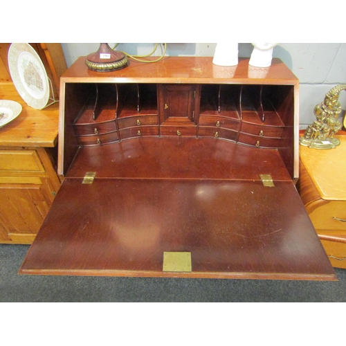 1040 - A mahogany reproduction bureau in the 18th Century style. Two short over three graduating long drawe... 