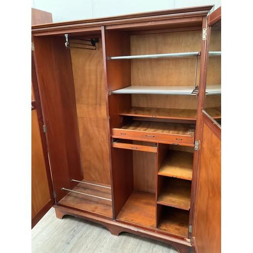 1067 - An early-mid 20th Century mahogany gentleman’s wardrobe with fitted interior, bracket feet. 177cm x ... 