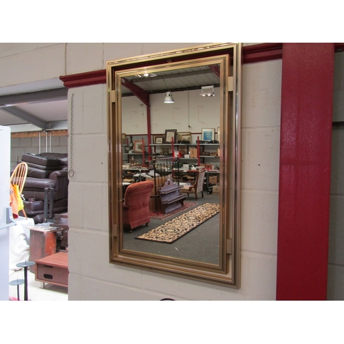 1074 - A Pierre Vandel (Paris) gold coloured framed mirror, overall 89cm x 59.5cm